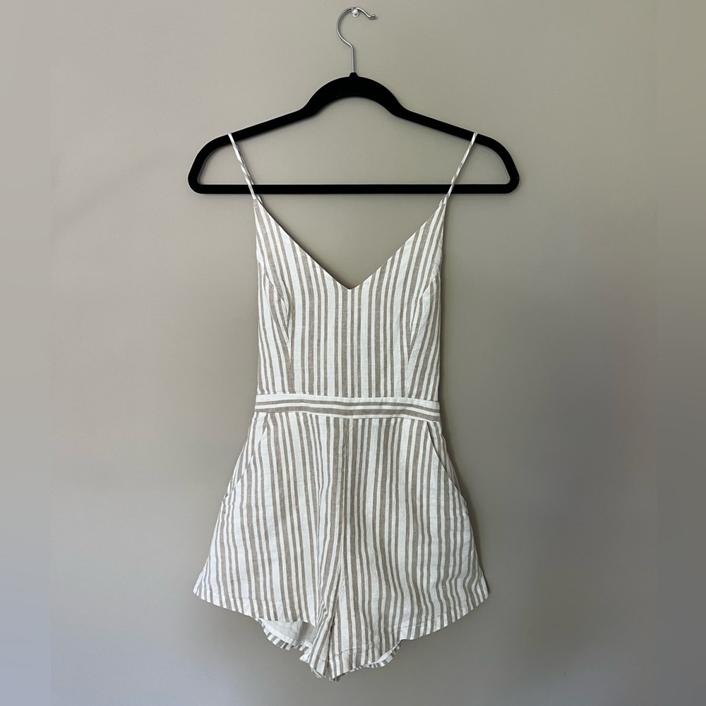 Tan and white striped romper with lace up back